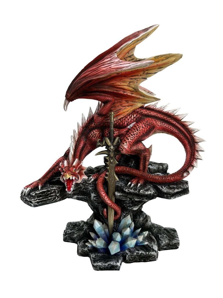 Dragon figurine on a rocky base with crystals, white background