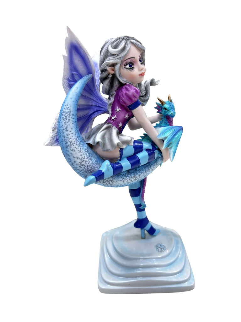 Colorful figurine of a mermaid with blue and purple accents on a white background