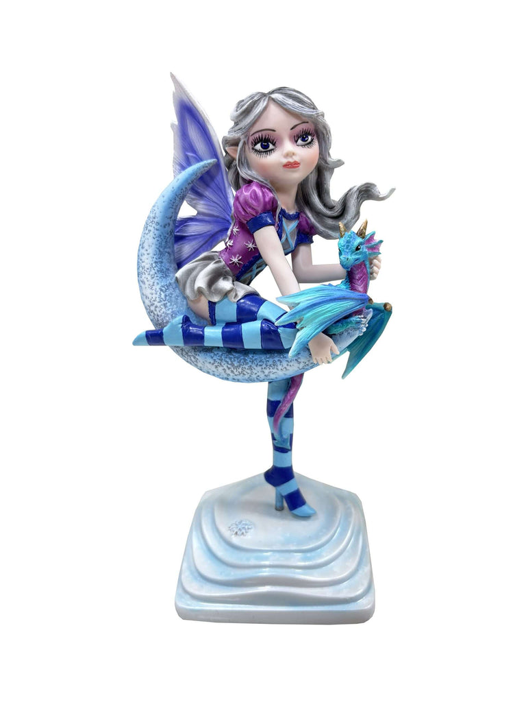 Fairy figurine with blue wings and dress on a white background