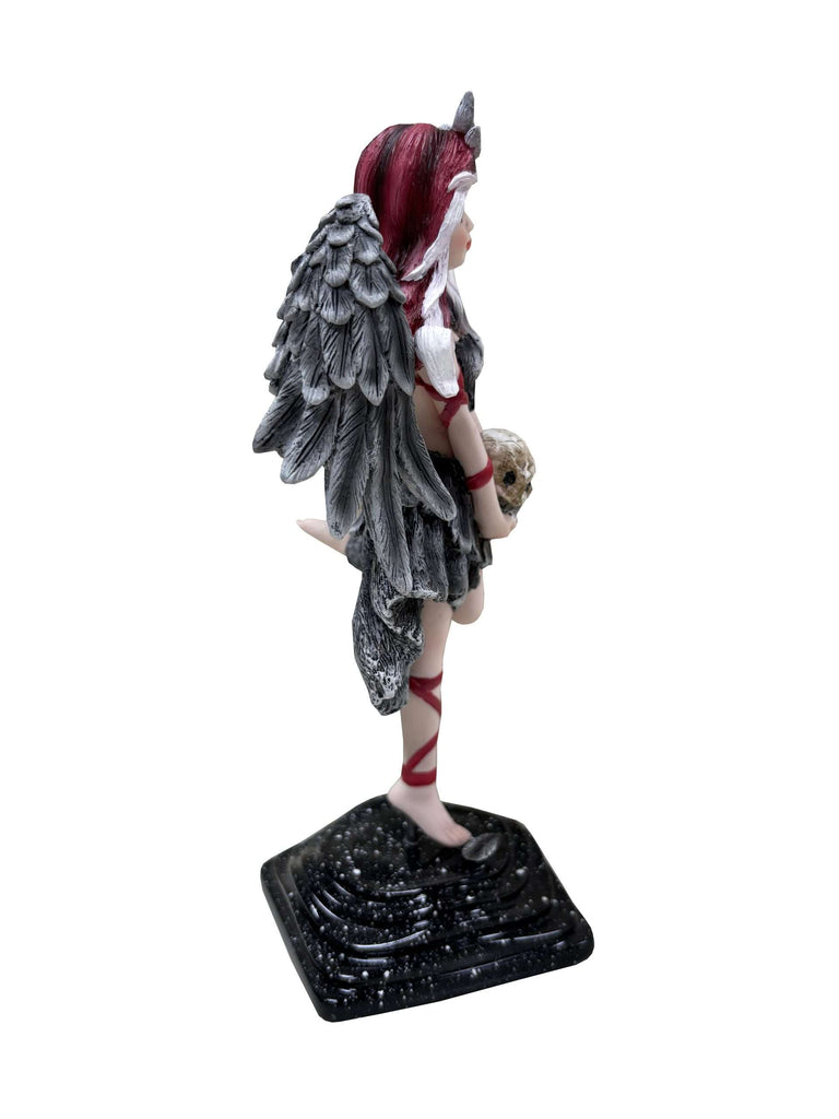 Statue of a fantasy character with wings and red hair on a white background
