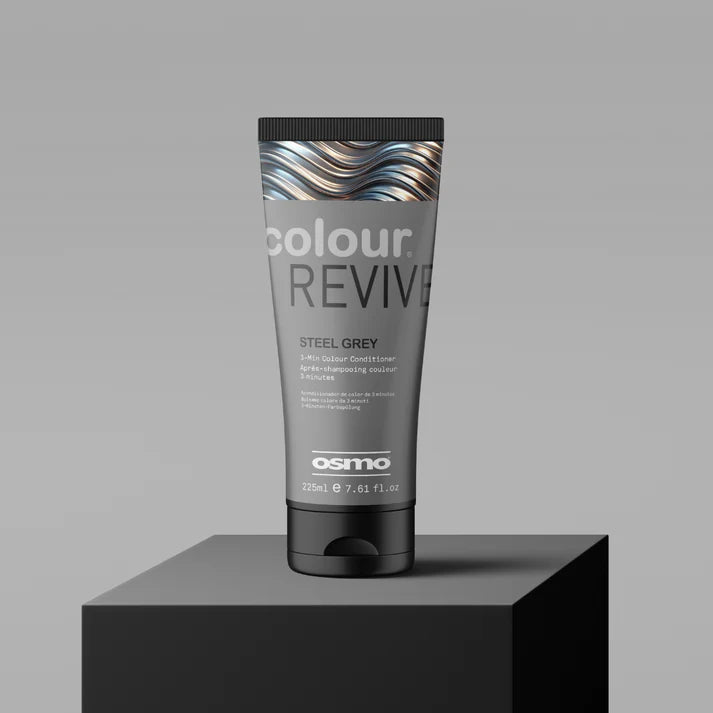 Osmo Colour Revive Steel Grey hair color tube on a gray background