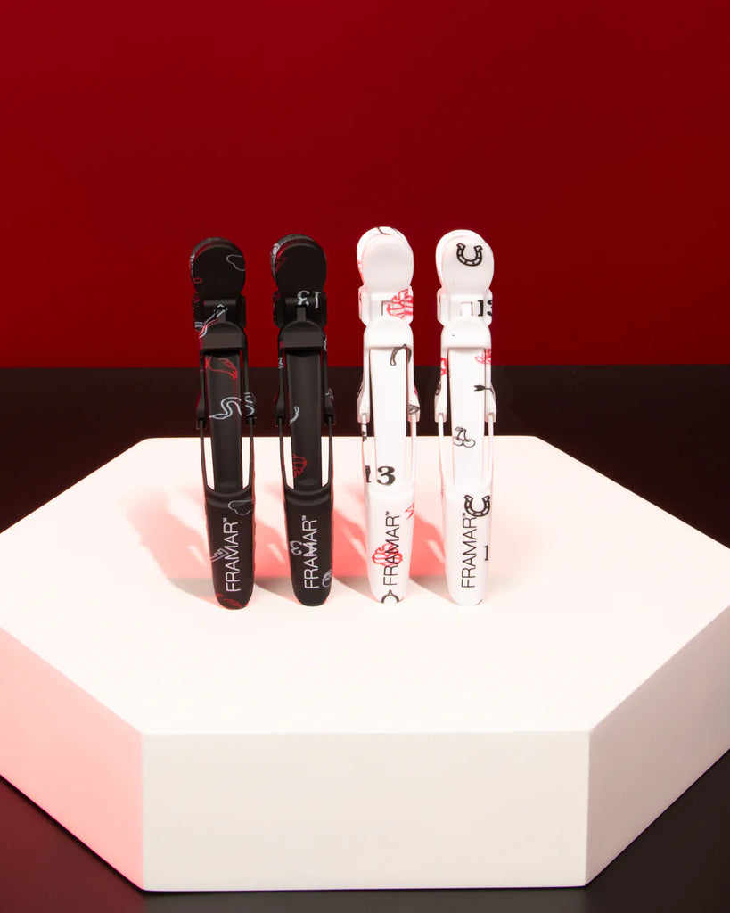 Four lip products on a hexagonal white platform with a red background