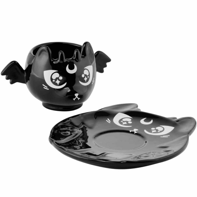 Black cat-shaped mug and saucer set on a white background