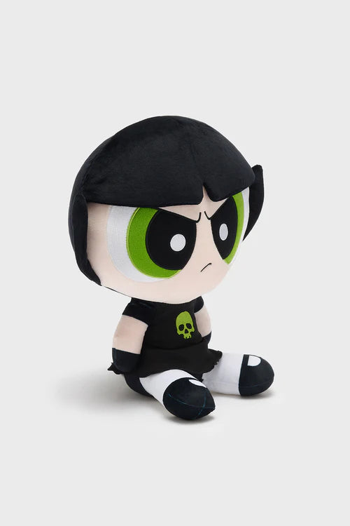 Plush toy with black hair, green eyes, and a black shirt on a light gray background