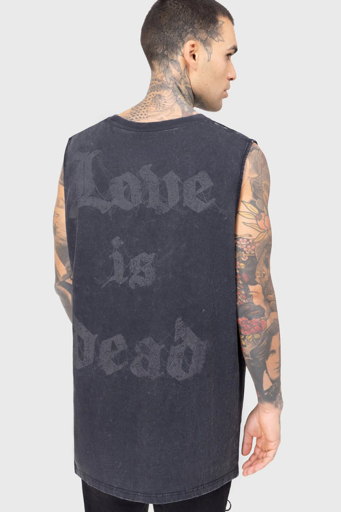 Person wearing a sleeveless black shirt with 'Love is Dead' text on the back against a gray background
