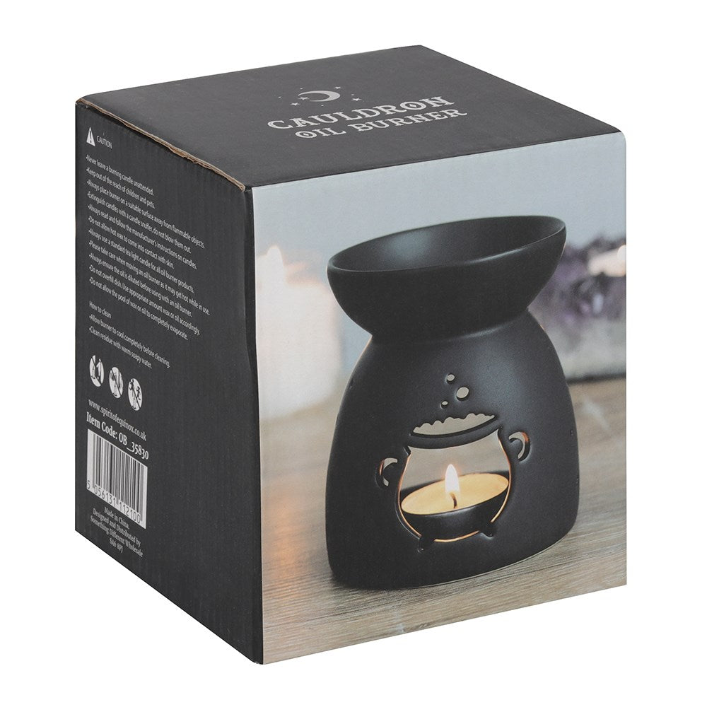 Black oil burner in packaging with 'Cauldron Oil Burner' text on a white background