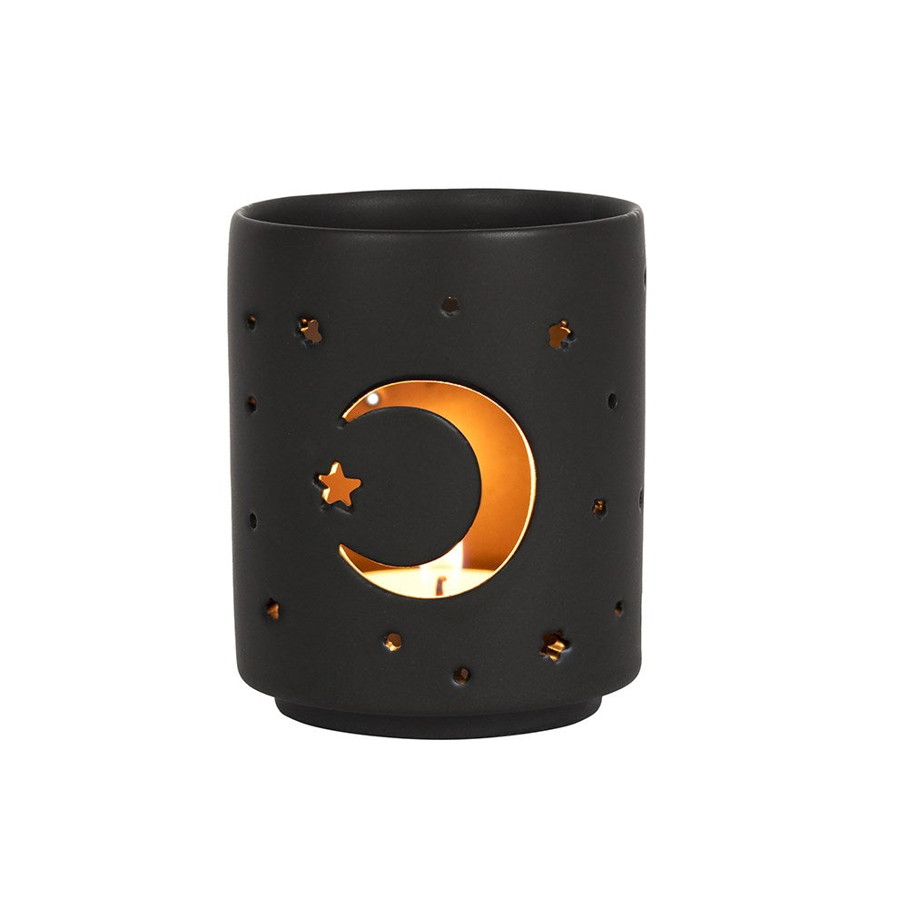 Black candle holder with moon and star design on a white background