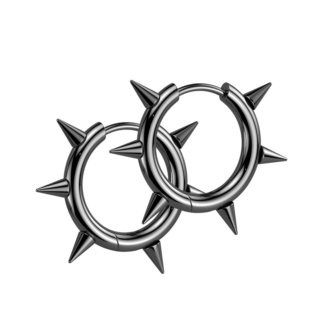 Pair of silver hoop earrings with spike details on a white background