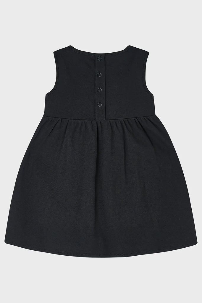 Black dress with buttons on a white background