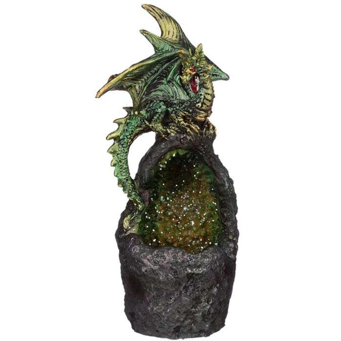 Dragon figurine on a rock with a white background