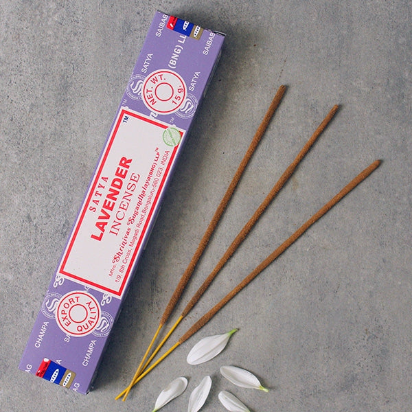 Satra Lavender incense packaging with incense sticks on a gray surface