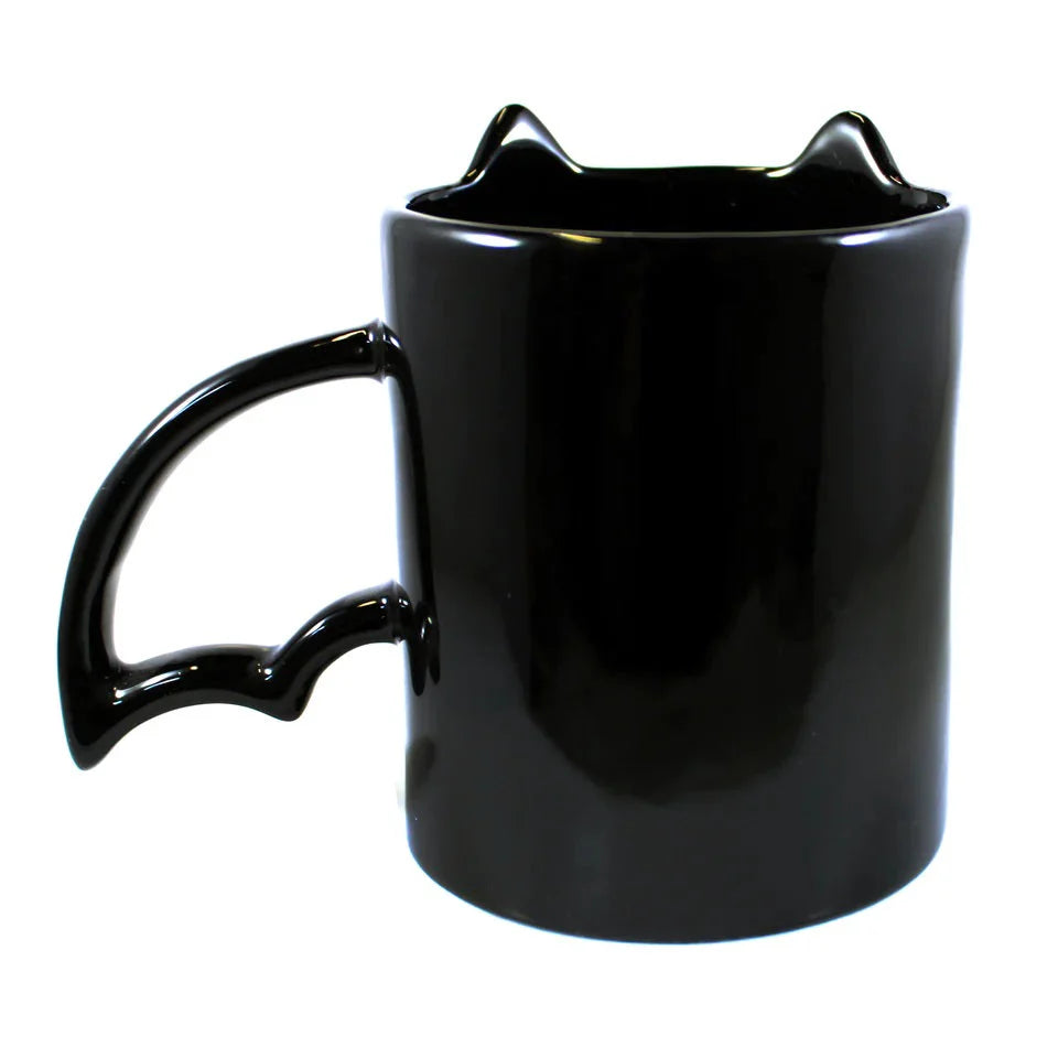 Black cat-shaped mug on a white background