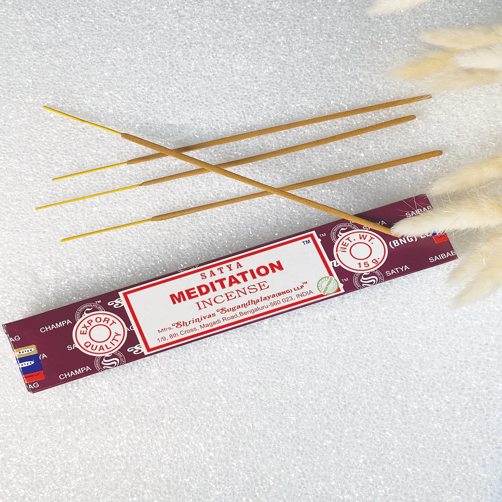 Satya Meditation incense sticks on a white background