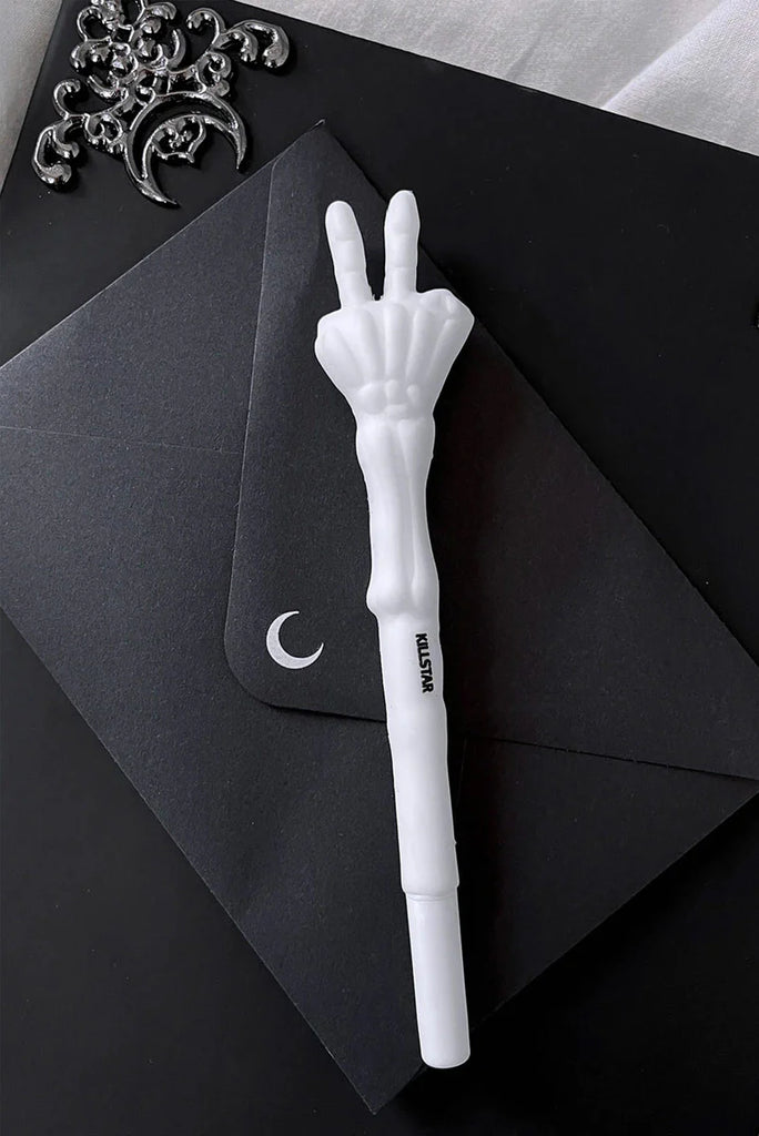 White pen with a unique design on a black background